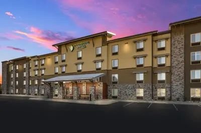 a rendering of the front of a hotel at WoodSpring Suites Fort Collins in Fort Collins