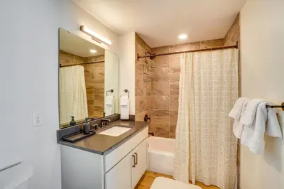 a bathroom with a sink and a shower at Modern Winter Park Condo with Community Hot Tub! in Winter Park