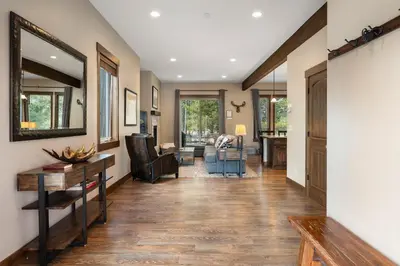 a hallway of a home with a desk and chairs at Mountain Haus home in Fraser