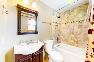 a bathroom with a sink and a toilet and a shower at Wapiti Point in Grand Lake