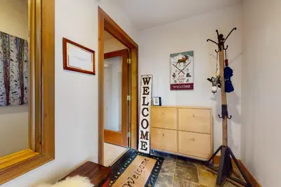a room with a room with a mirror and a closet at Elk Trail Retreat in Winter Park
