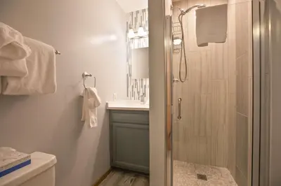 a bathroom with a shower and a toilet and a sink at Windwood Alpine Townhome: Downtown Frisco in Frisco