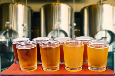 a group of glasses of beer sitting on a table at Windwood Alpine Townhome: Downtown Frisco in Frisco