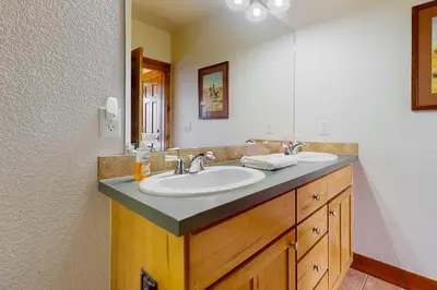 a bathroom with a sink and a mirror at Majestic Mountain Escape in Granby