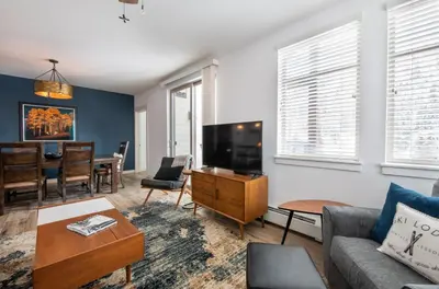 a living room with a couch and a tv at Premium Unit 4575-Fraser Crossing Founders Pointe condo in Winter Park