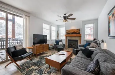 a living room with a couch and a tv at Premium Unit 4575-Fraser Crossing Founders Pointe condo in Winter Park
