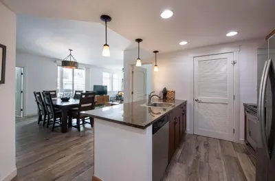 a kitchen with a counter and a dining room at Premium Unit 4575-Fraser Crossing Founders Pointe condo in Winter Park