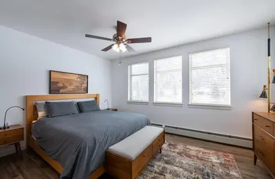 a bedroom with a bed and a ceiling fan at Premium Unit 4575-Fraser Crossing Founders Pointe condo in Winter Park