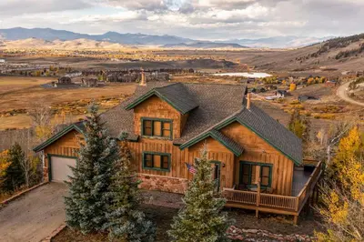 a log home with a view of the mountains at Private Hot Tub Scenic Granby Vacation Rental! in Granby