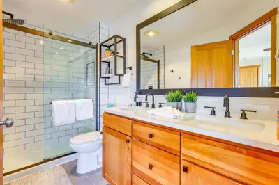 a bathroom with a sink and a toilet and a shower at Private Hot Tub Scenic Granby Vacation Rental! in Granby